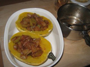 Squash halves, filled with sautéed pears, ready for final 5 minutes in microwave 