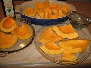 Sliced up pumpkin, lightly basted with olive oil, ready for oven roasting 