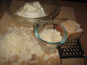 Ricotta, half the Parmigiano-Reggiano and an egg to be whisked in bowl 
