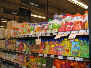 Aisle at the Honest Weight Food Co-op for baby food: Co-op’s food policy considers “moral & ethical production, environmental stewardship, healthy living a & safety