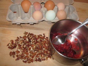 Cranberries gently cooked down into sauce to add to batter with pecans and eggs