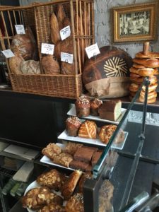 Breads and pastries for the day including Bolzano niche (made with rye, spelt, cumin, coriander & fennel) and the bakery's millstone logo in its crust