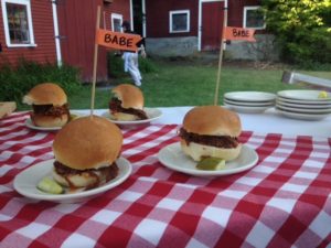 Pull pork sandwiches stacked high on mini brioche buns