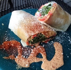 Maggie’s Three Cheese Melt Wrap with roasted red pepper dressing